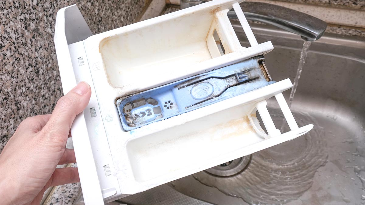 Очистить лоток стиральной машины от накипи